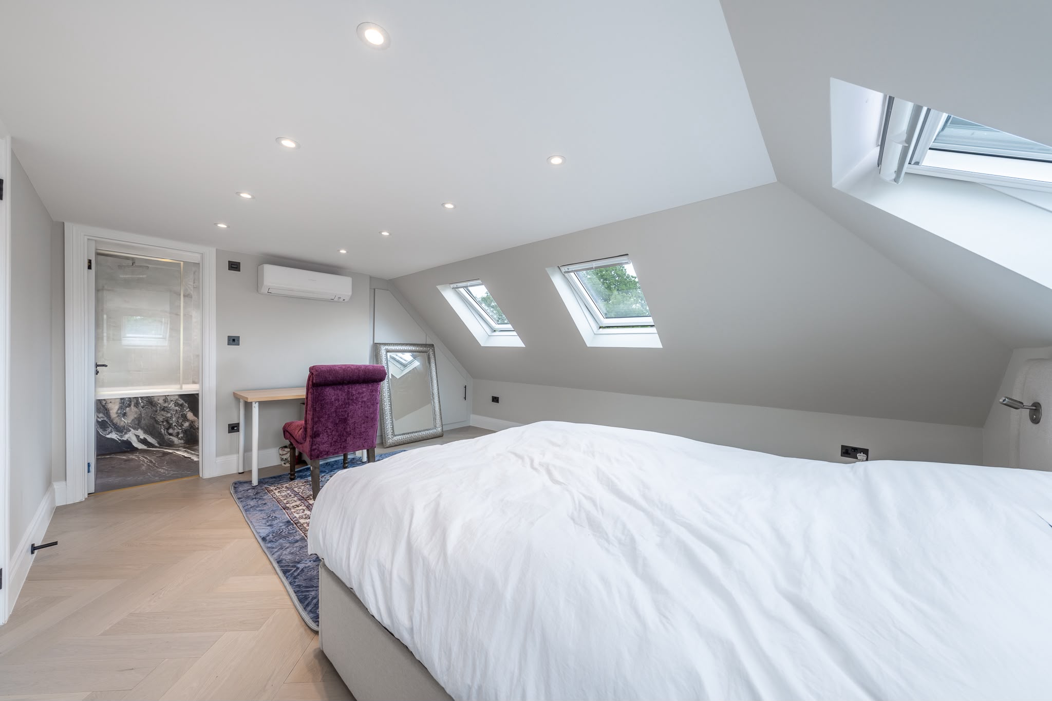 Principal bedroom at loft level with exposed structural steel